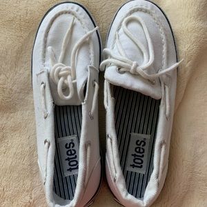 Women’s size 7 totes boat sneakers.  Never worn!!